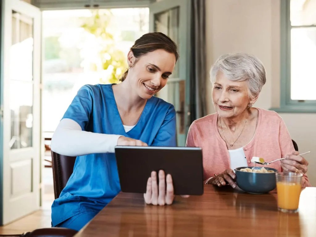 Caregiver engaging in conversation with an elderly client